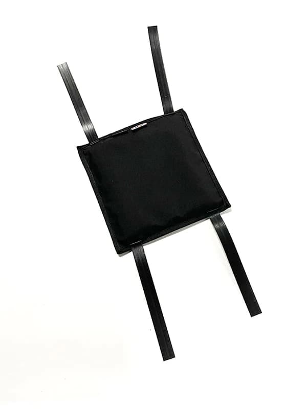 Black square training pad with four long straps extending from its sides on a white background.