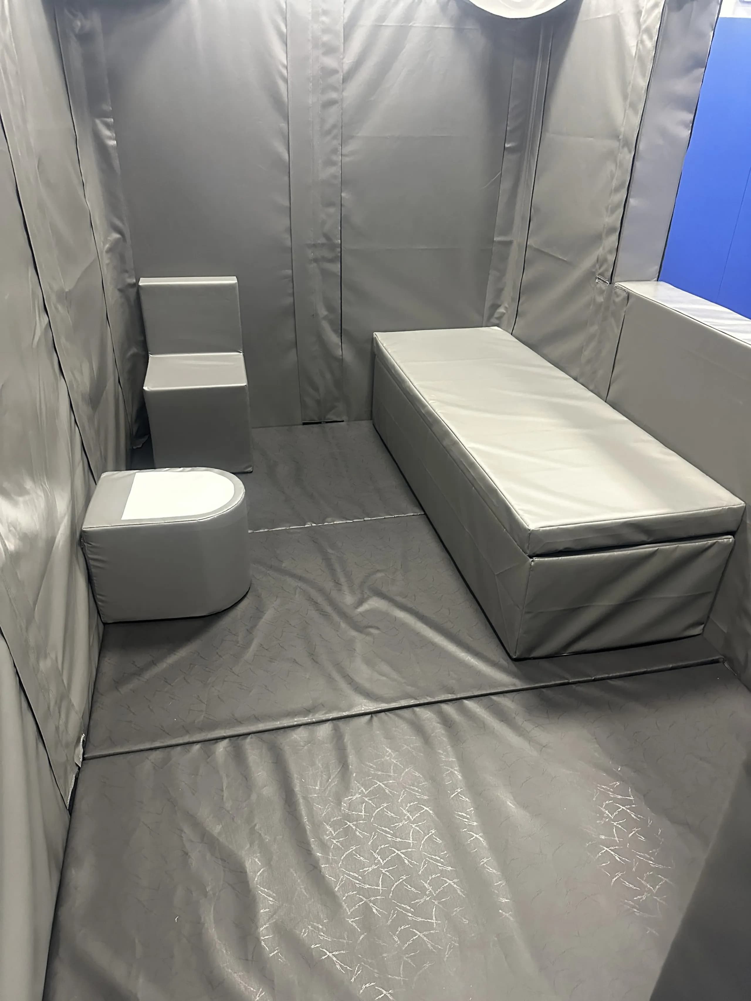 inside cell bed, chair &amp; toilet